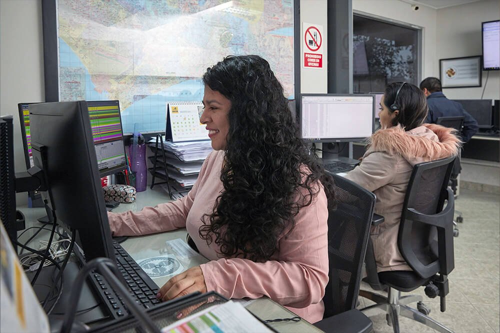 woman sitting in the dispatching office at computer 